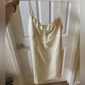 Light yellow mini dress with ribbon keyhole on front